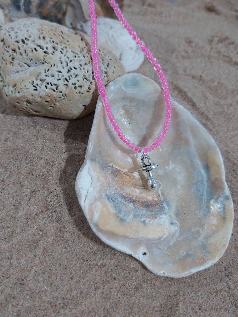 Baby dummy charm on a seed bead anklet