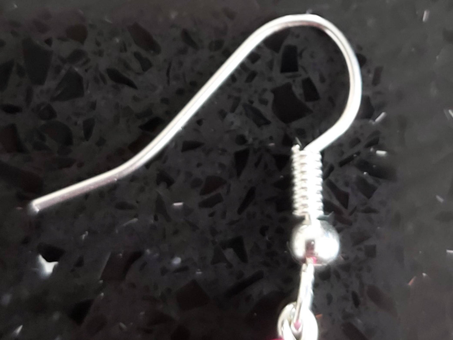 Feather Tribal style earring.