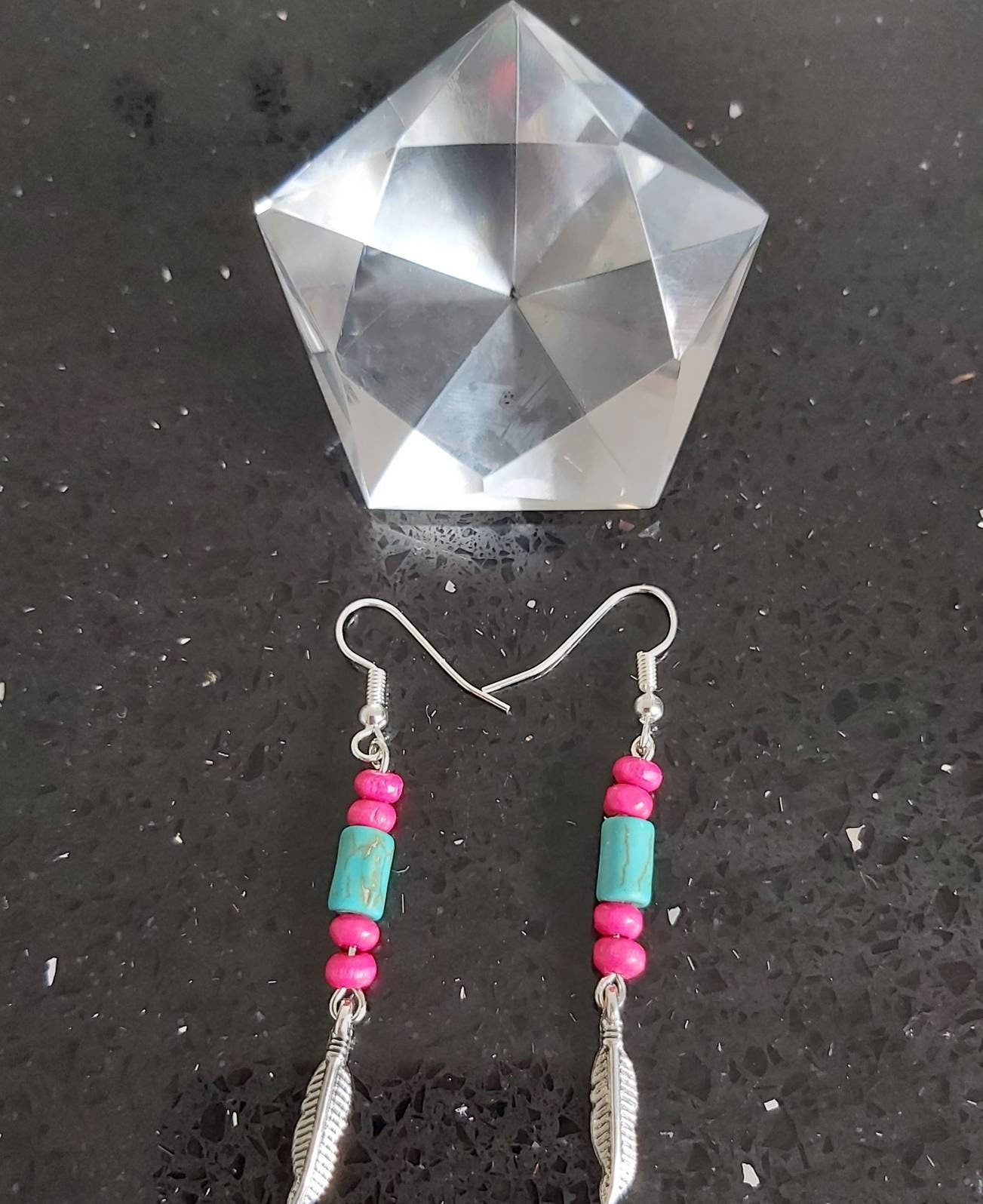 Feather Tribal style earring.