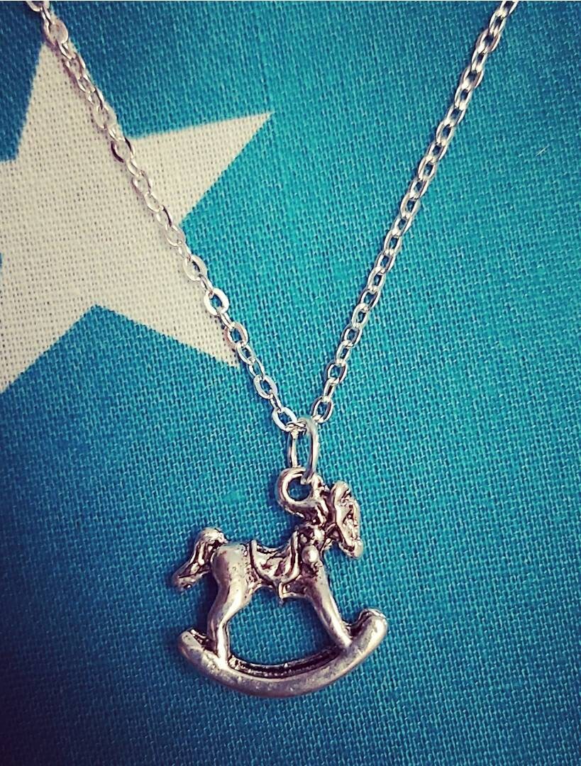 Rocking horse necklace and earrings.