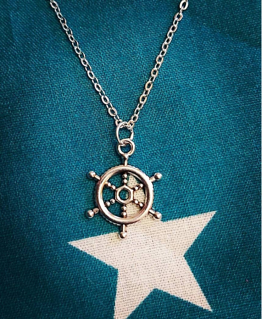 Ships wheel necklace and earrings.
