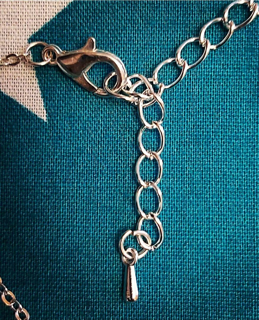 Ships wheel necklace and earrings.