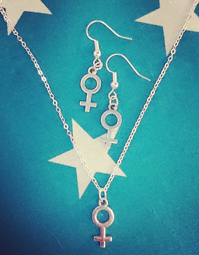 Female symbol necklace and earrings.