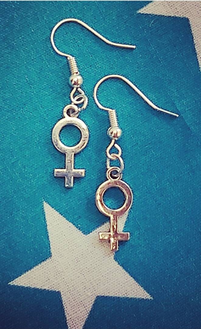 Female symbol necklace and earrings.