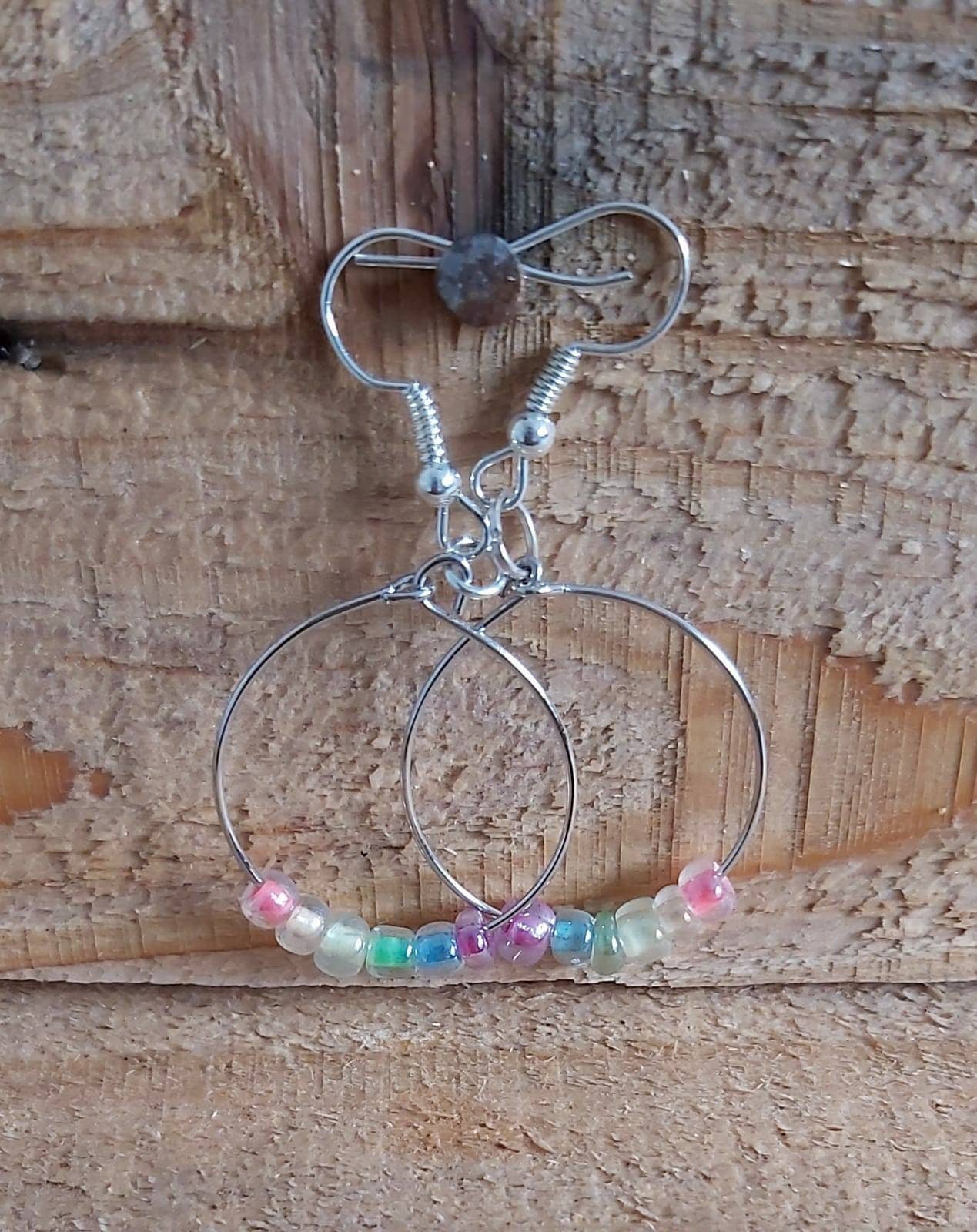 Rainbow seed bead hoop earrings.